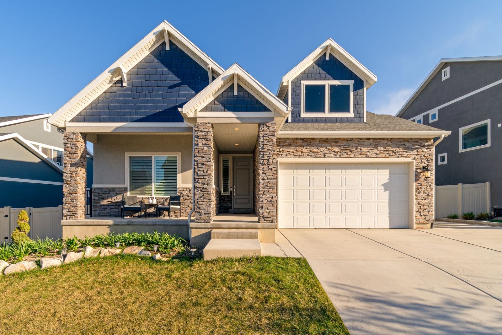 Upscale single-family home with a clean roofline in Cedar City, Utah, served by Zenic Industries roofing.