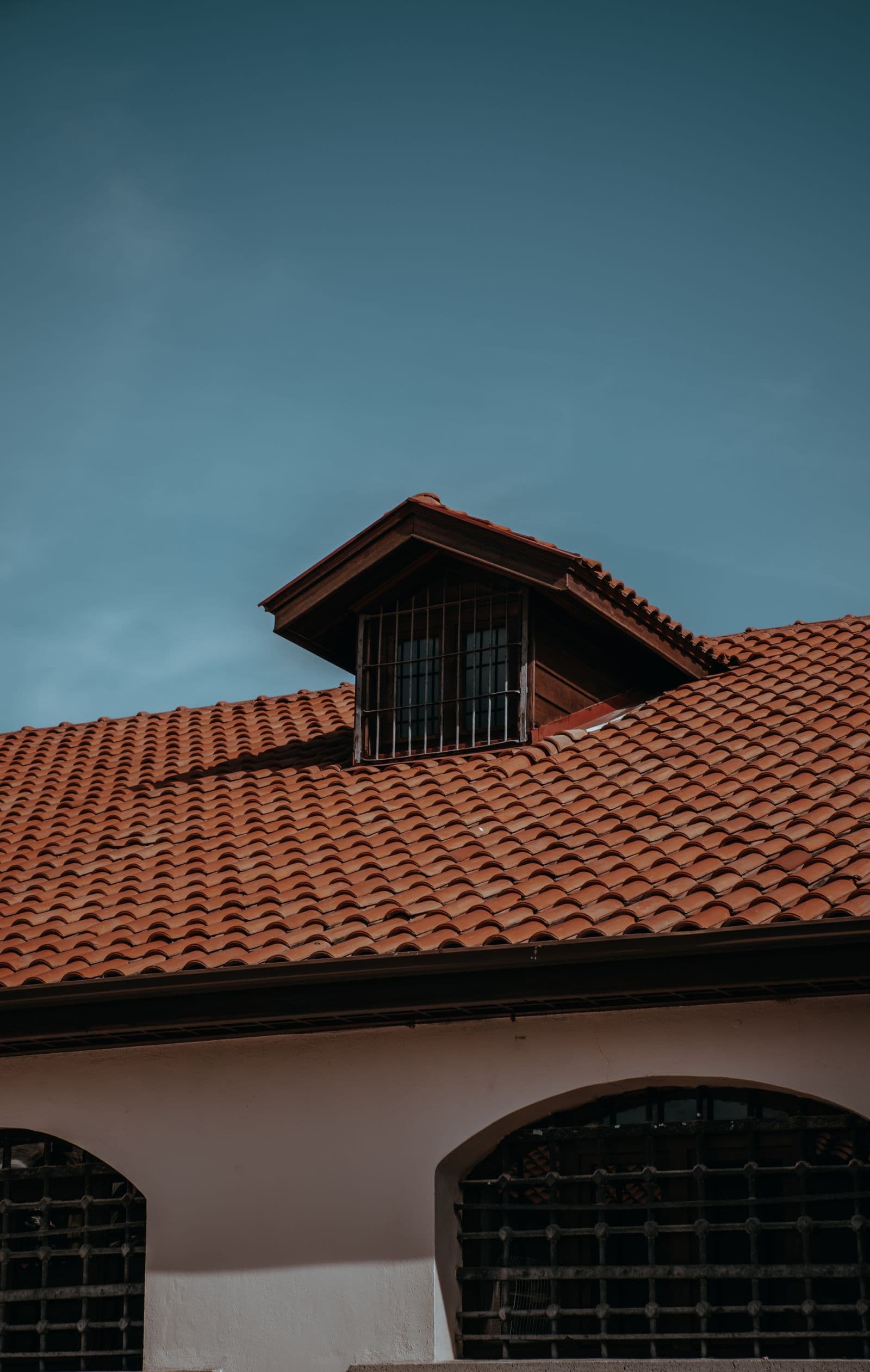 Red-rock-toned tile roof on a Kanab, Utah desert home, served by Zenic Industries roofing.